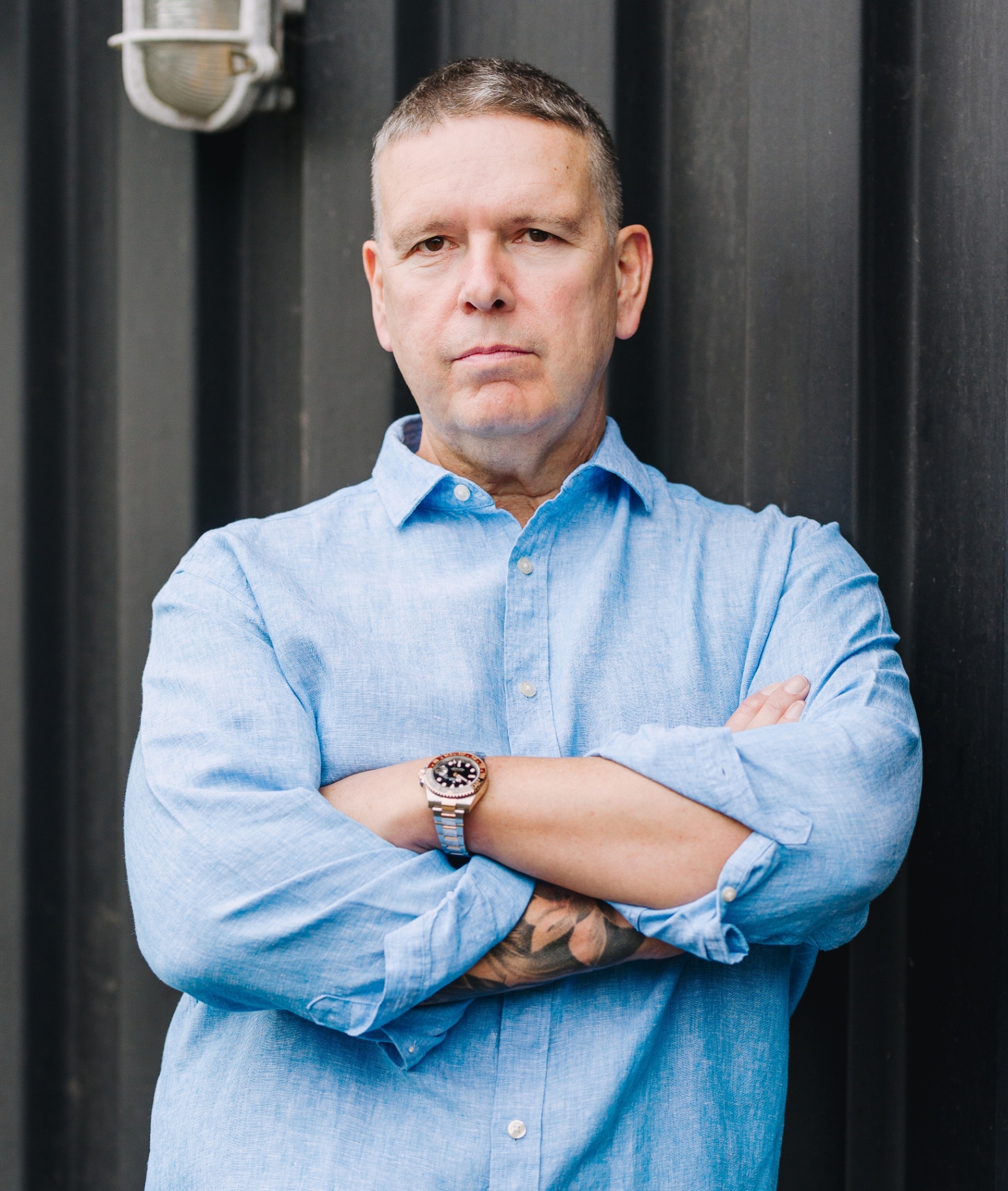 Steve Matthews outdoors, arms folded